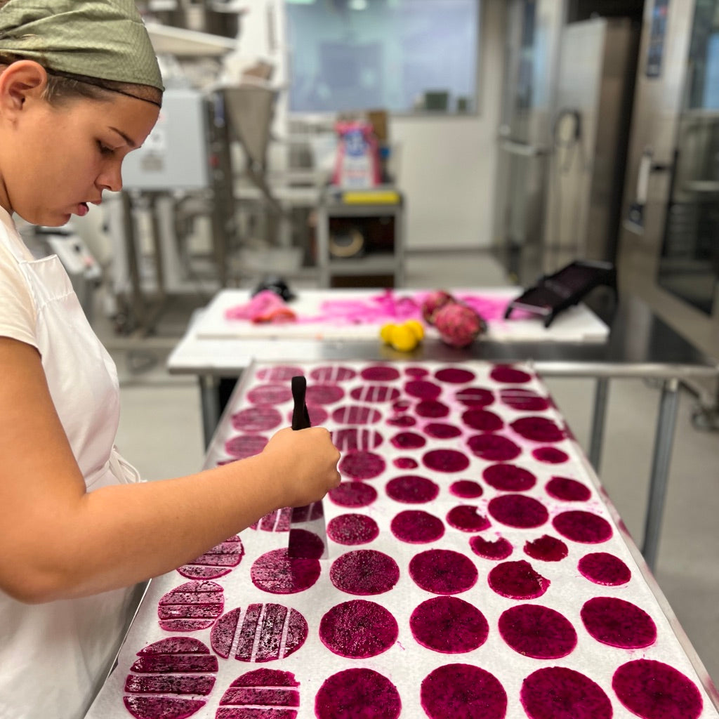 Woman preparing Maui Cocktail Kits for diy tropical cocktails